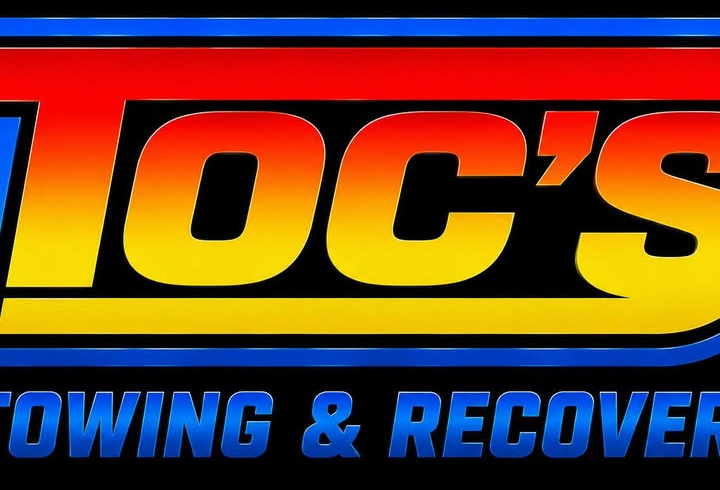 Toc's Towing & Recovery logo: red and yellow TOC'S lettering over blue TOWING & RECOVERY